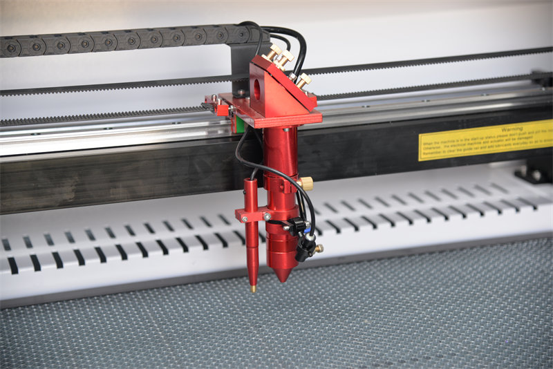 High quality laser head of 1390 co2 laser cutting machine.